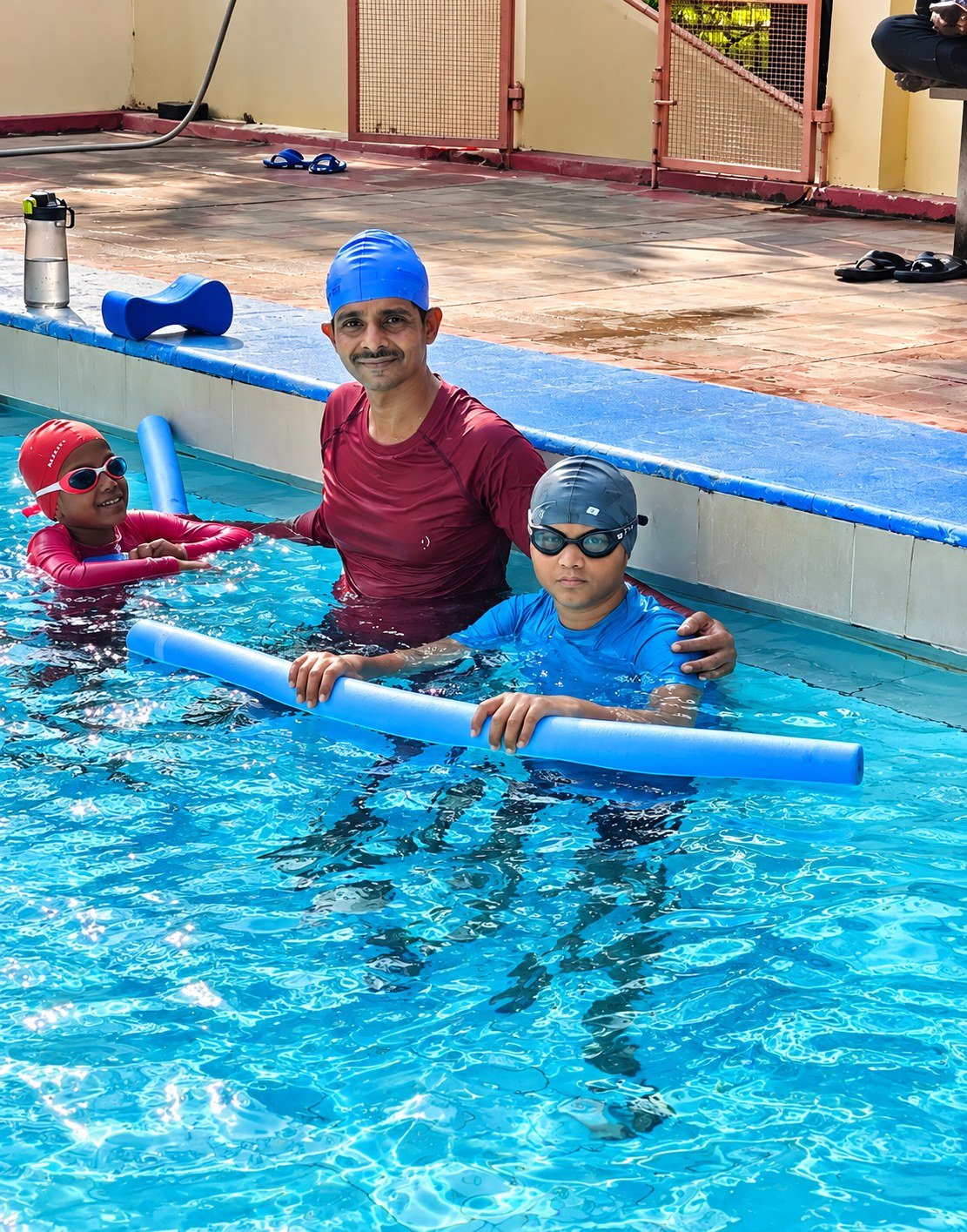 Instructor guiding a child through water exercises