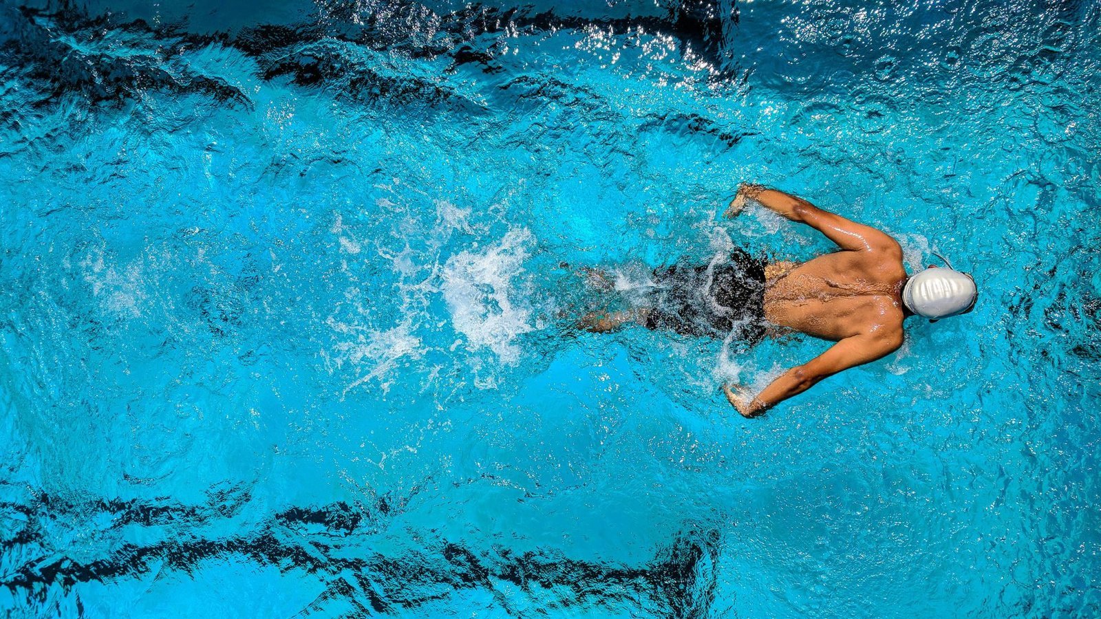 Swimmer in action mid-stroke